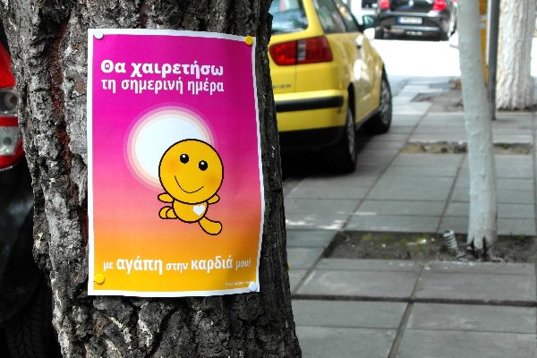 Poster on tree: I will greet this day with love in my heart