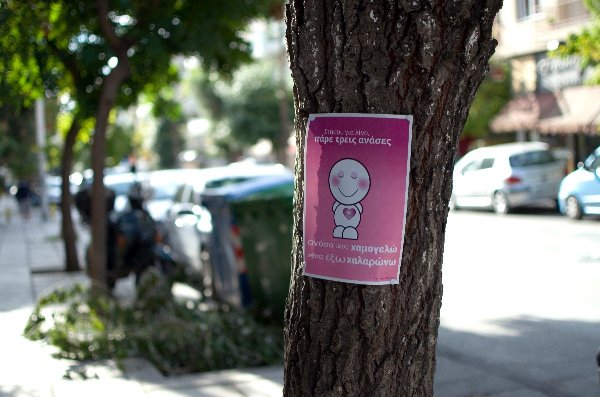 Poster on tree: Breath In, Smile :) Breath Out, Relax...