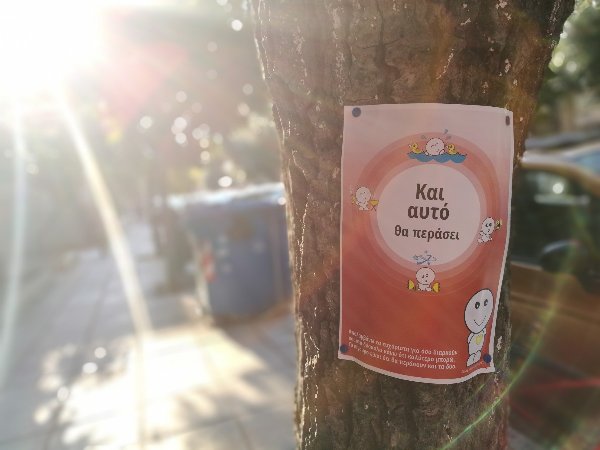 Poster on tree: This, too, will pass.